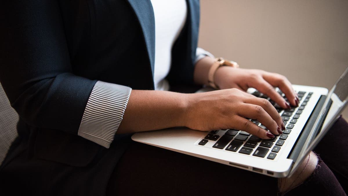 typing on laptop keyboard