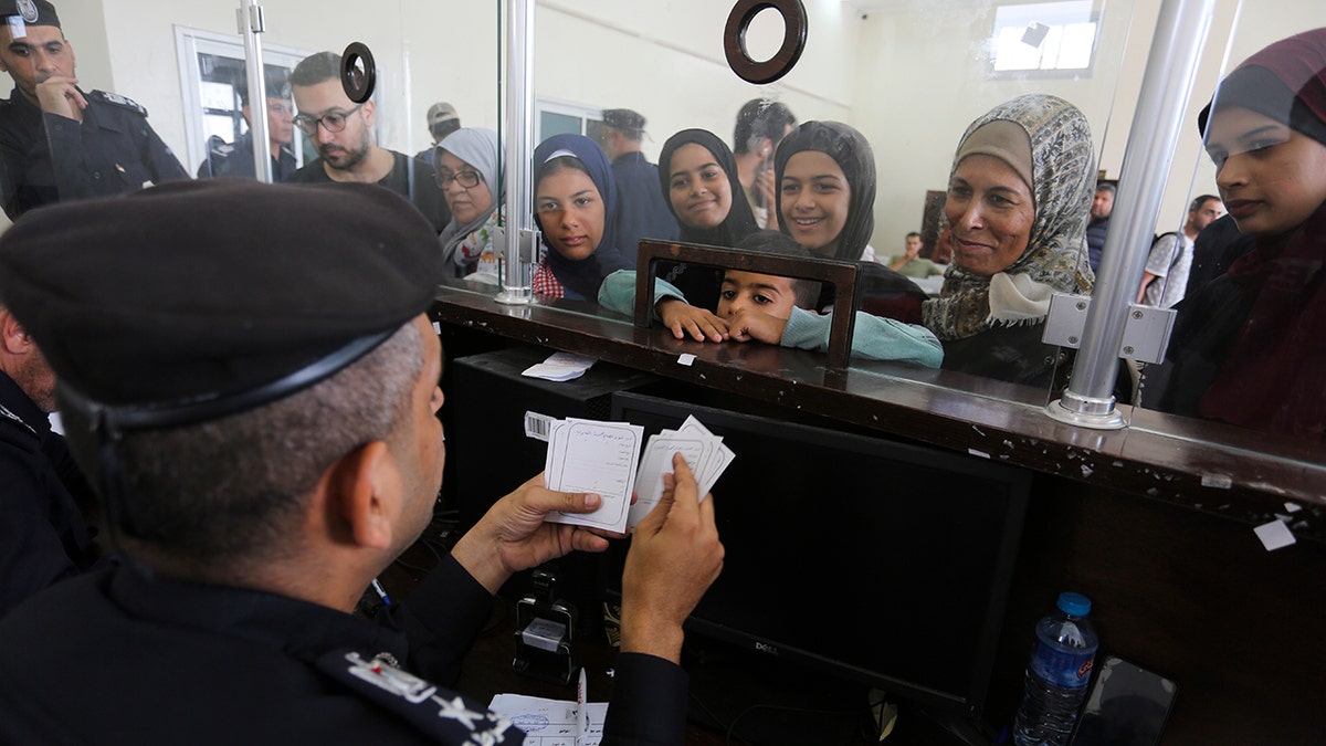 Palestinians seek to cross into Egypt from the Gaza Strip