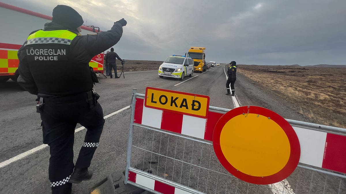 Police direct traffic away from Grindavik, Iceland