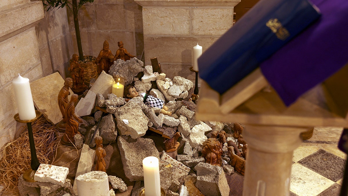 Bible on a podium, nativity scene