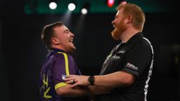 LONDON, ENGLAND - DECEMBER 27: Luke Littler of England and Matt Campbell of Canada interact during Day Ten of the 2023/24 Paddy Power World Darts Championship at Alexandra Palace on December 27, 2023 in London, England. (Photo by Warren Little/Getty Images)