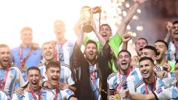LUSAIL CITY, QATAR - DECEMBER 18: Lionel Messi of Argentina lifts the FIFA World Cup Qatar 2022 Winner's Trophy during the FIFA World Cup Qatar 2022 Final match between Argentina and France at Lusail Stadium on December 18, 2022 in Lusail City, Qatar. (Photo by Julian Finney/Getty Images)