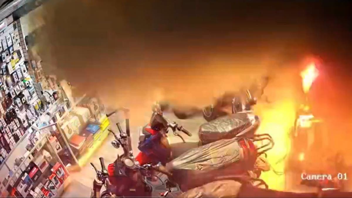 A screenshot showing the moment an e-bike lithium-ion battery catches fire and explodes, burning down a store in Queens.
