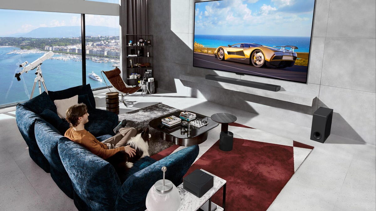 An LG M4 wireless TV hangs on the wall.