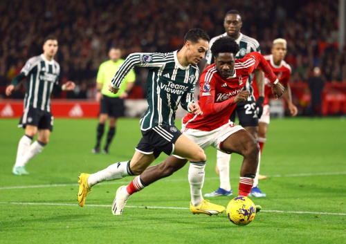 Soccer Football - Premier League - Nottingham Forest v Manchester United - The City Ground, Nottingham, Britain - December 30, 2023  Nottingham Forest's Ola Aina in action with Manchester United's Antony