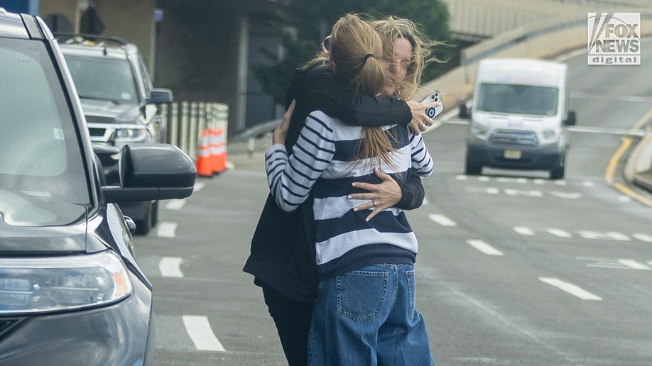 Michelle Troconis embraces family member