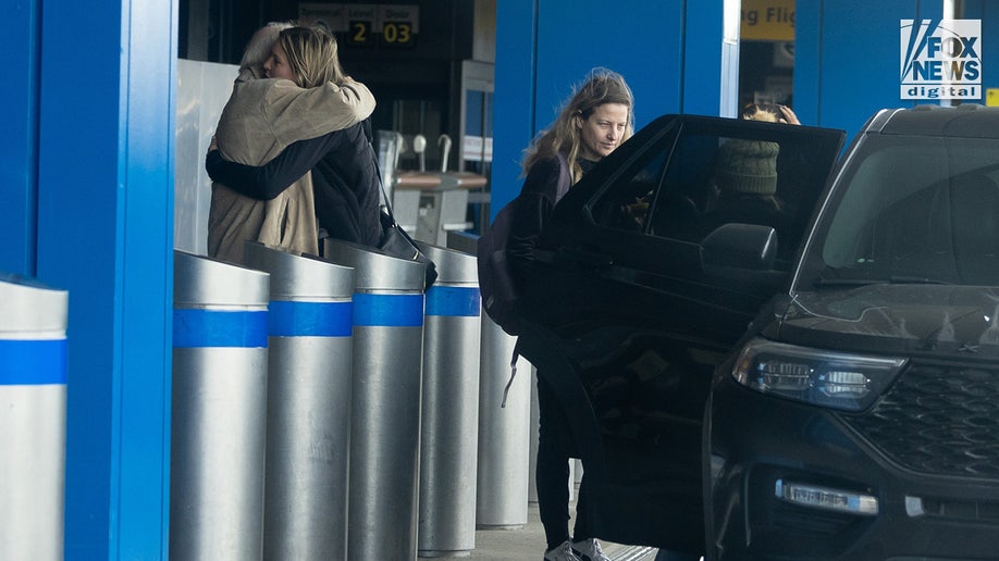 Michelle Troconis hugs family member