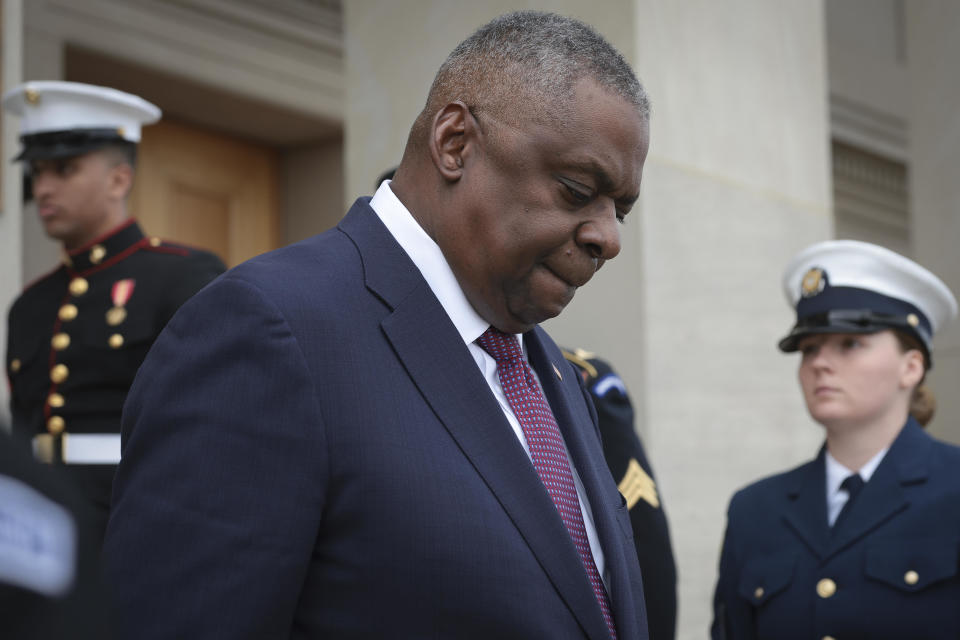 Secretary of Defense Lloyd Austin walks down the steps of the Pentagon to greet Romanian Prime Minister Marcel Ciolacu on Dec. 4, 2023, in Arlington, Virginia.  / Credit: Win McNamee/Getty Images