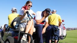 Scottie Scheffler of Team United States is consoled by his Wife, Meredith Scheffler after losing his match to Viktor Hovland and Ludvig Aberg of Team Europe (not pictured) 9&7 during the Saturday morning foursomes matches of the 2023 Ryder Cup at Marco Simone Golf Club on September 30, 2023 in Rome, Italy.