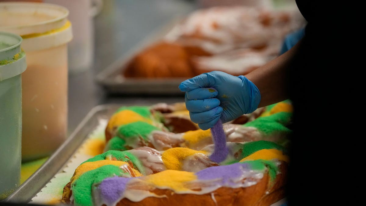 Lawren DiBella decorates king cakes