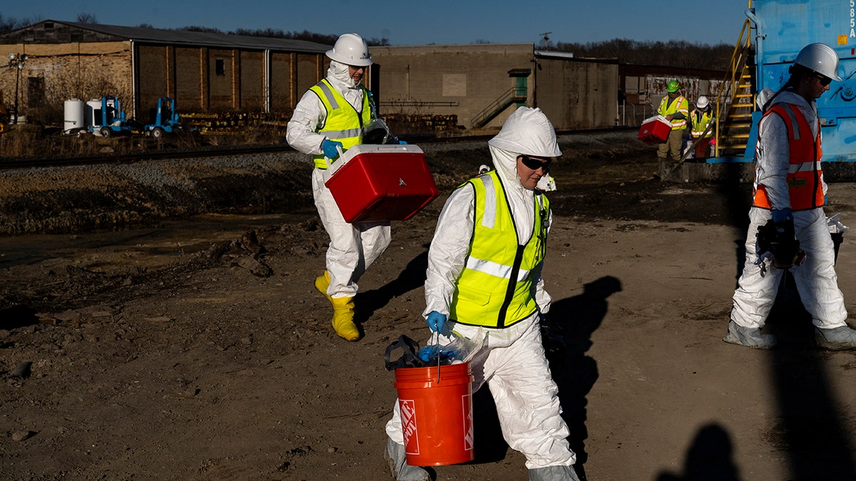 People in hazmat clothing