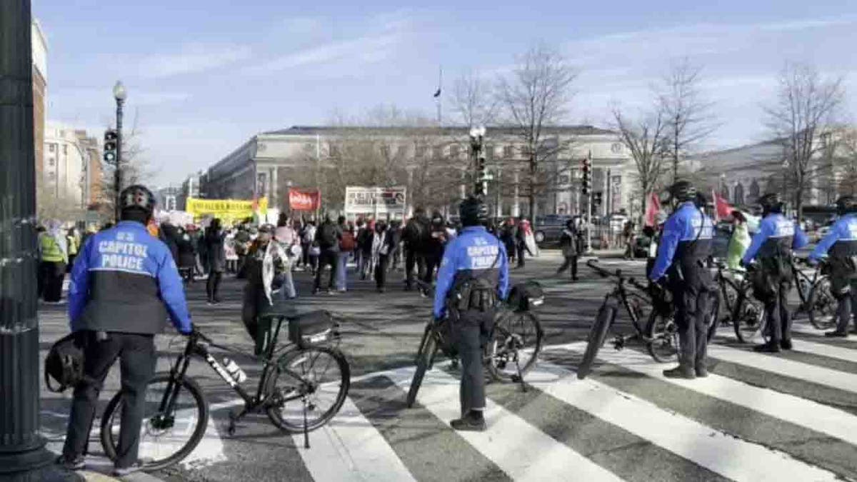 police blocking street ahead of protesters