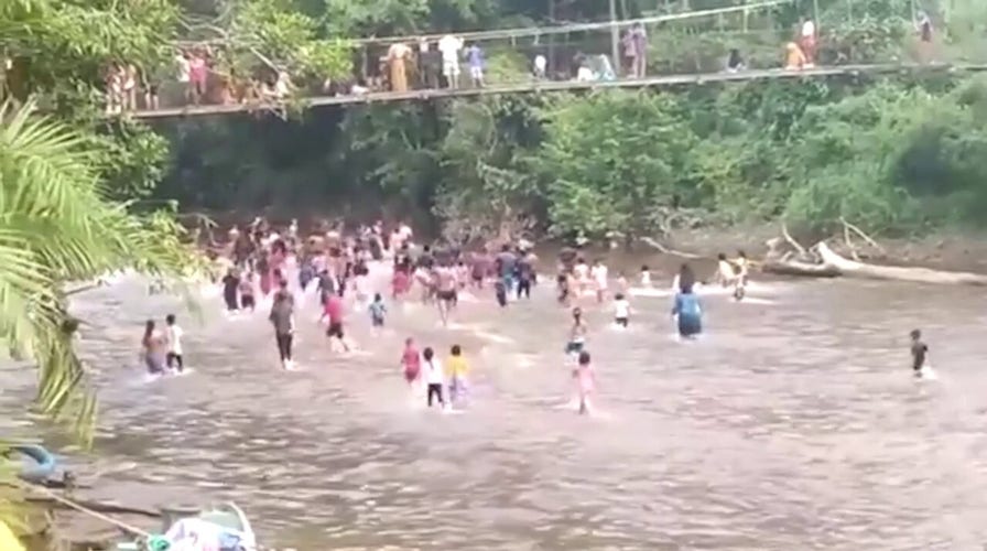 Bridge collapse over river injures 32 in Indonesia