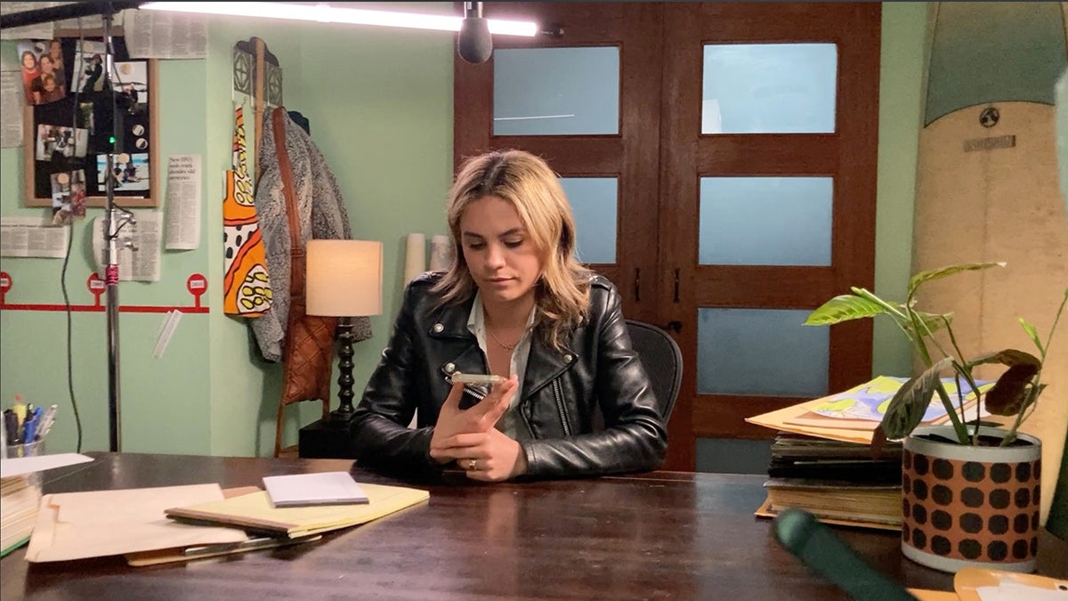 Sierra Barter making a phone call in War Room