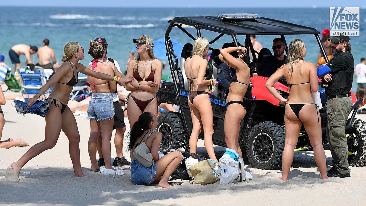 Spring breakers enjoy the beach in Florida