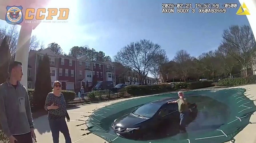 Georgia police rescue driver who crashed on top of covered pool
