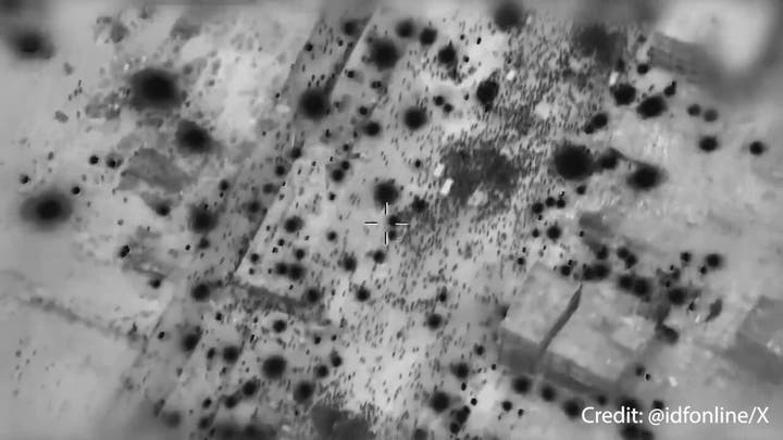IDF aerial footage shows Palestinian crowd swarming humanitarian trucks
