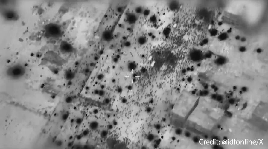 IDF aerial footage shows Palestinian crowd swarming humanitarian trucks
