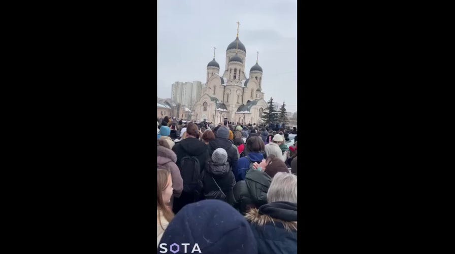Supporters of Russian opposition leader Alexei Navalny chant his name outside Moscow church - East2West