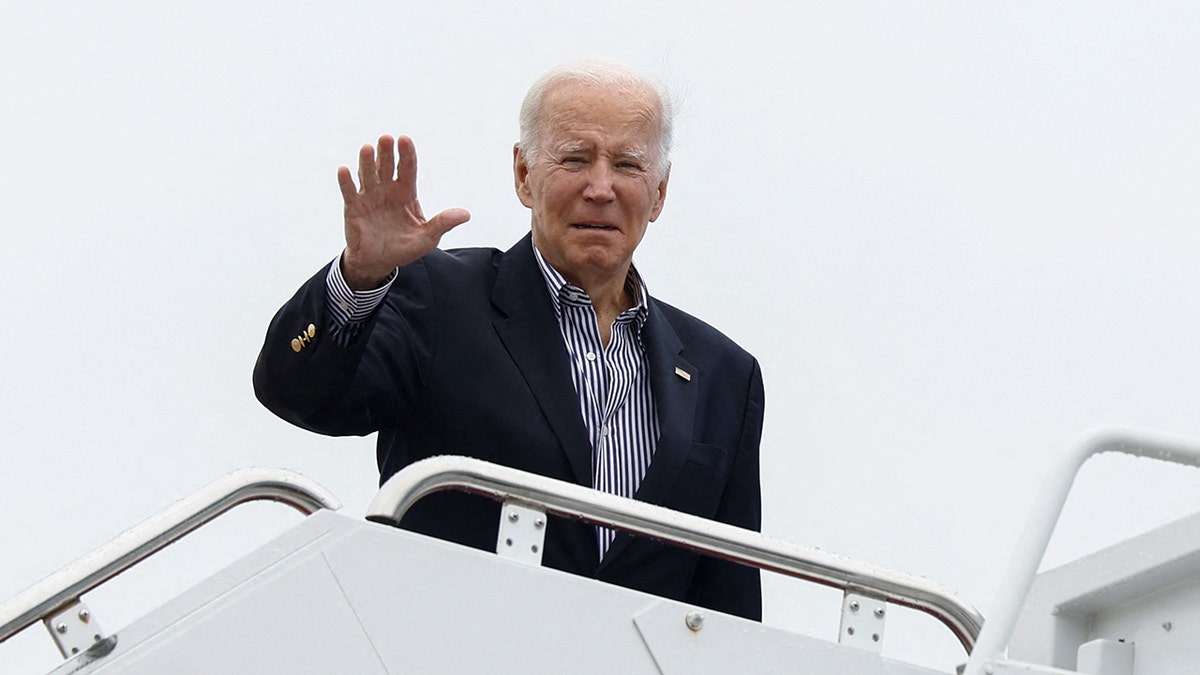 President Biden waves before departing for Florida to tour Hurricane Ian damage