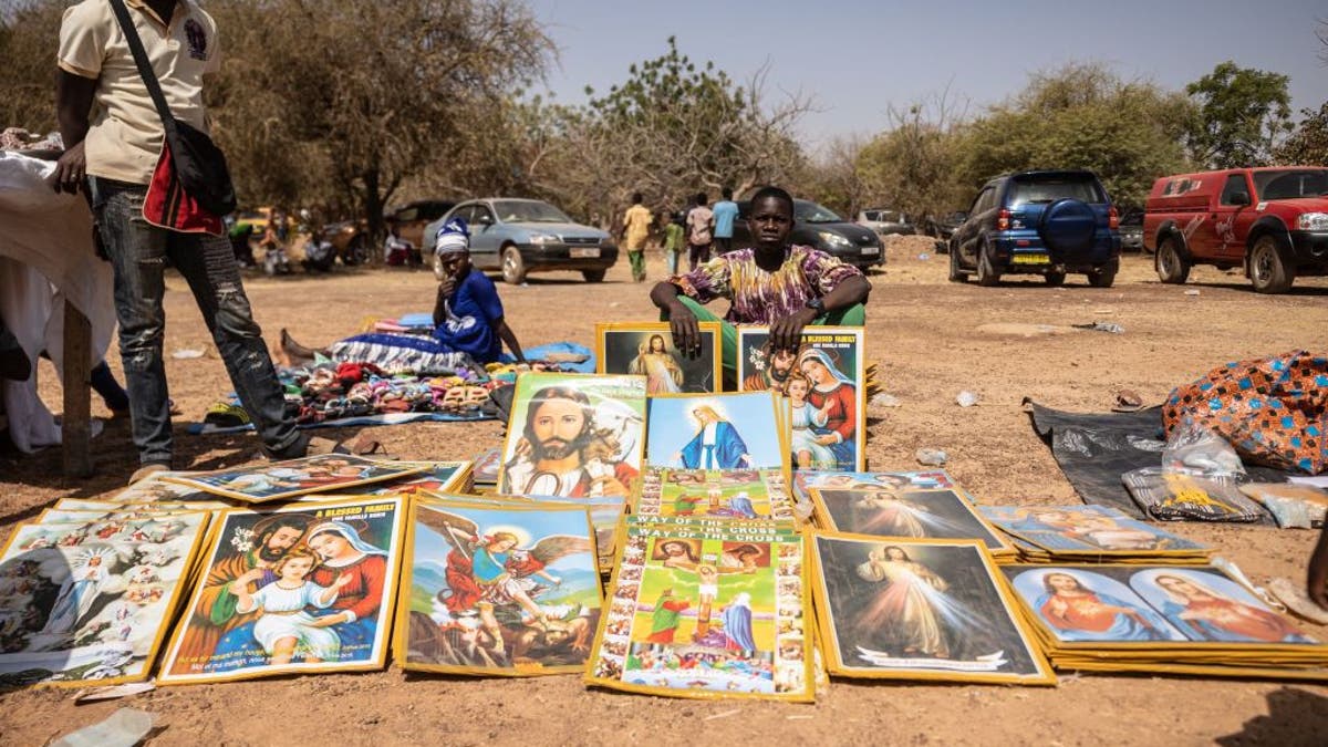 Boy selling memorabilia 