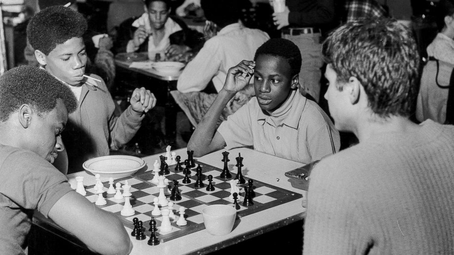 Members of Synanon play chess