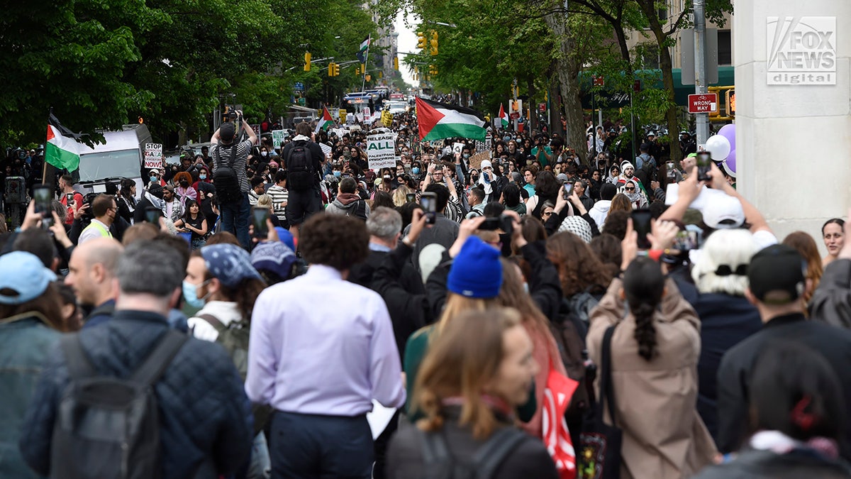 Anti-Israel protesters make their way down Fifth Avenue toward Washington Square Park