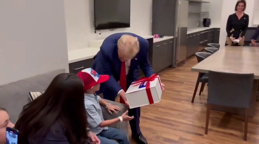 Former President Trump surprises young supporter at rally with birthday gift, visit