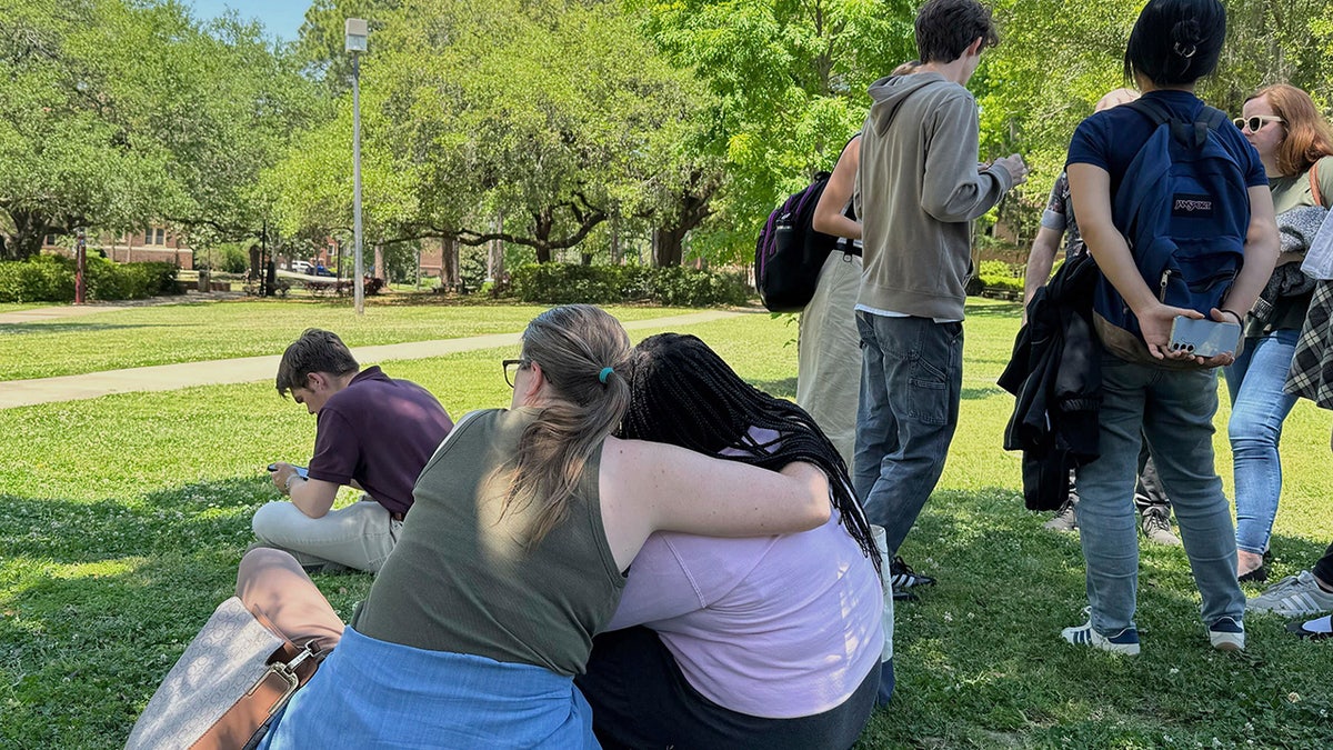 People comfort each other on FSU campus
