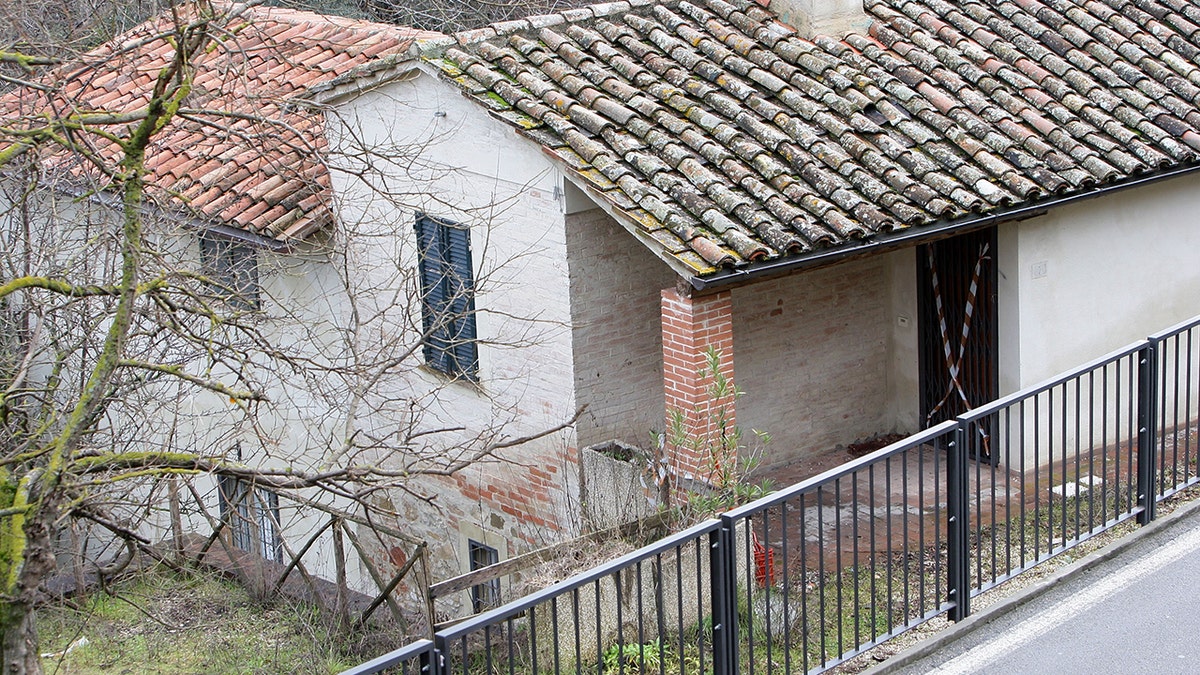 An exterior view of a cottage in Italy.