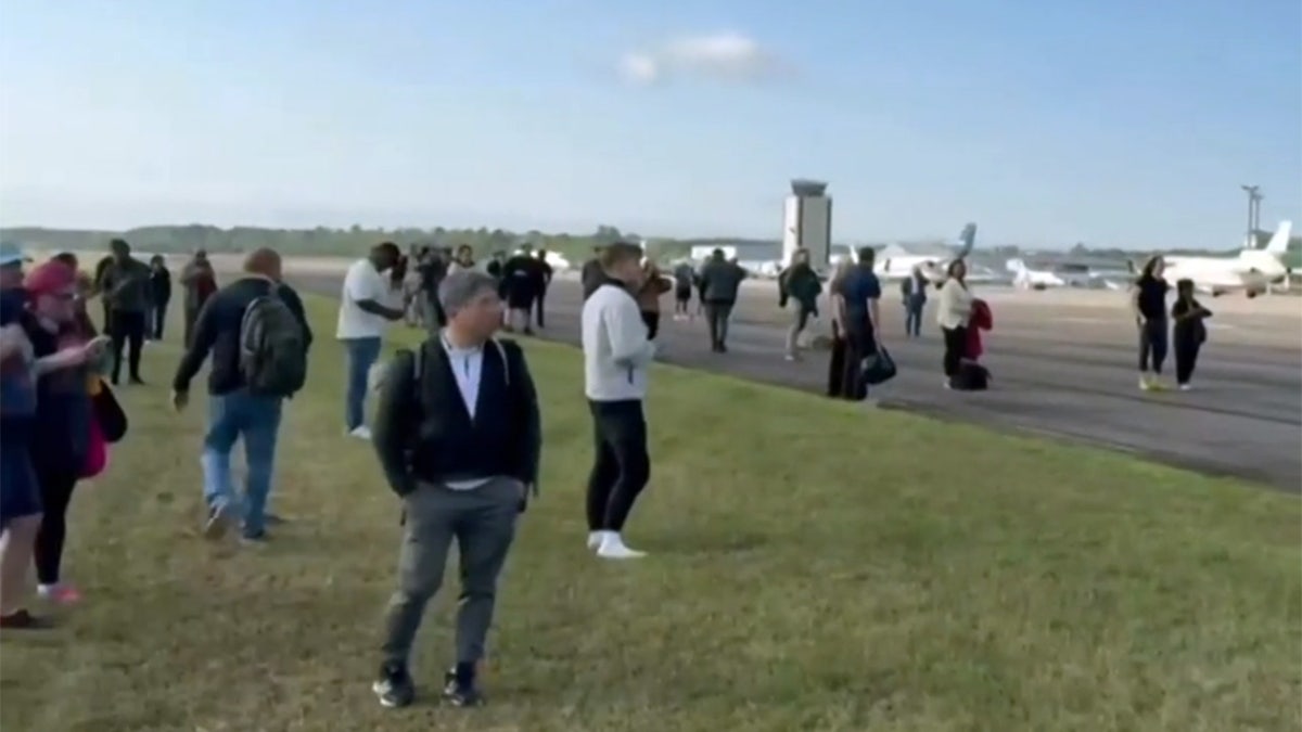 Passengers stand at Augusta Regional Airport after landing
