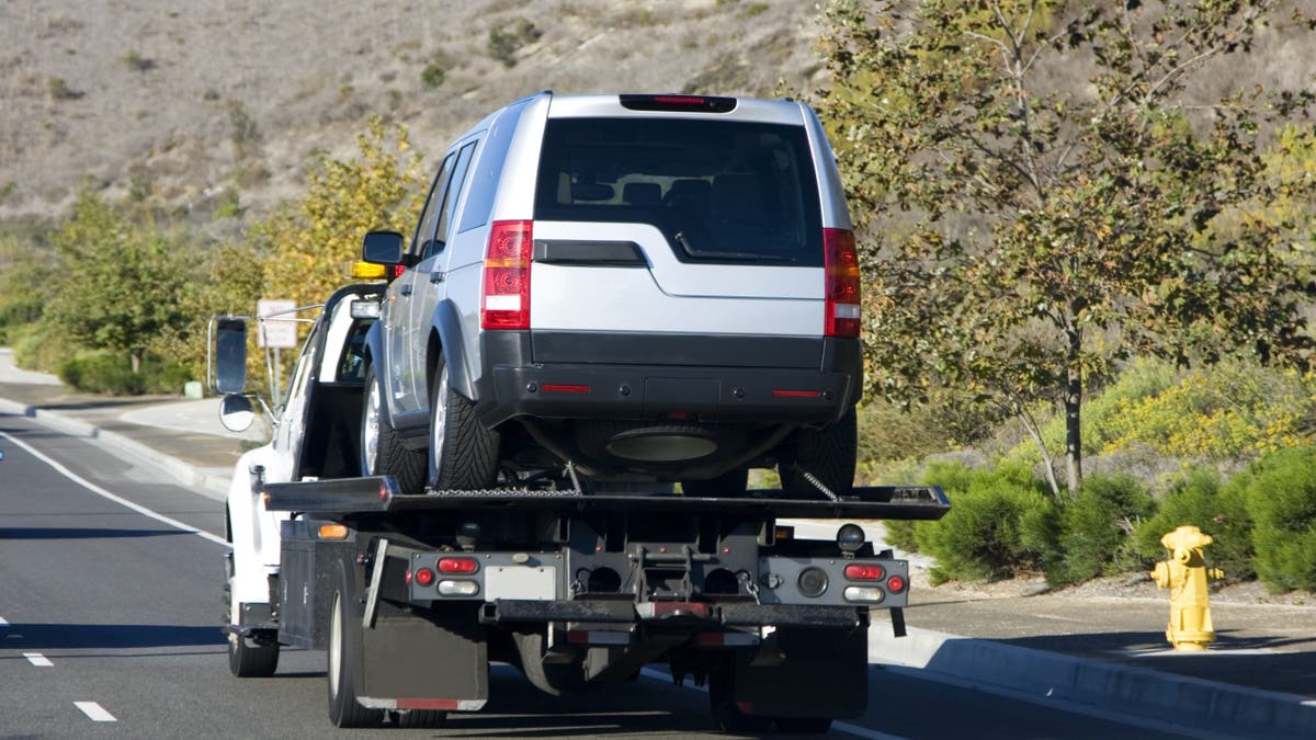 Tow truck taking SUV