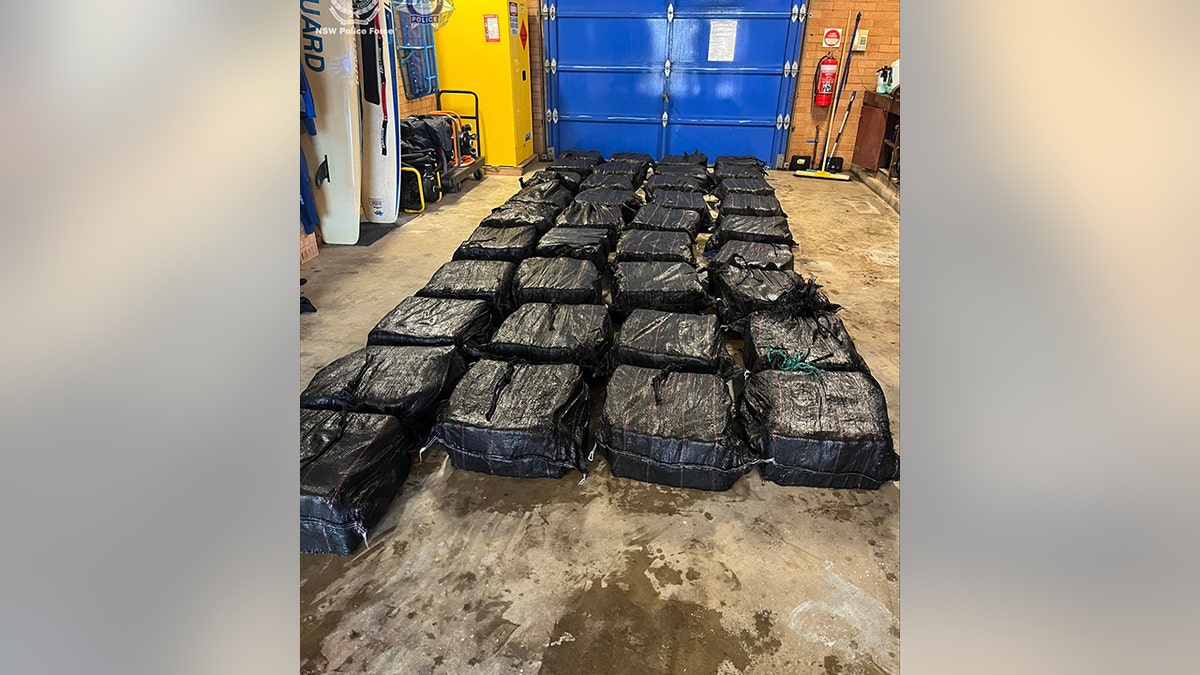 seized cocaine in black bags on the floor