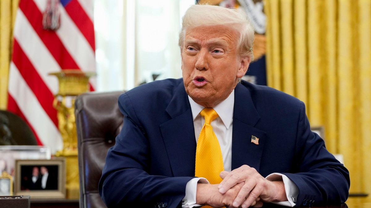 Donald Trump closeup shot seated at desk in Oval Office