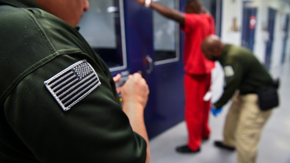 Immigration detainees are processed in Miami, Florida