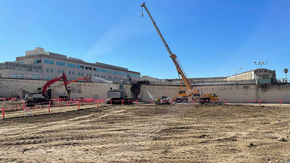 Crews work to clear an area where the San Quentin Rehabilitation Center will be built.