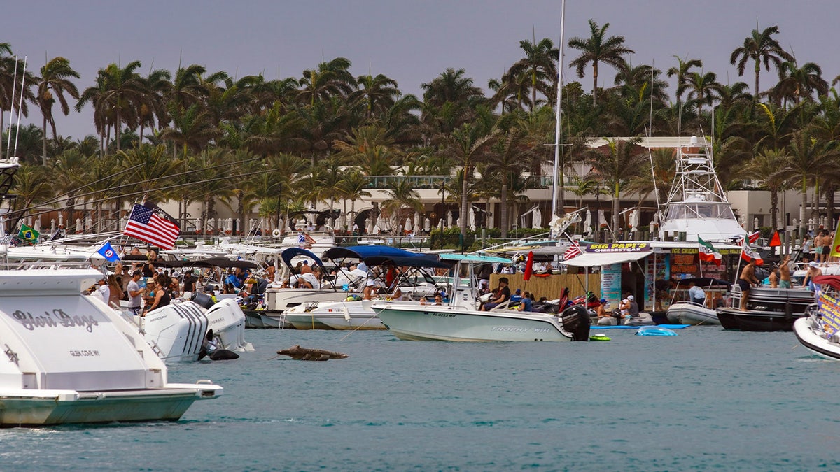 People boating, dancing and drinking alcohol