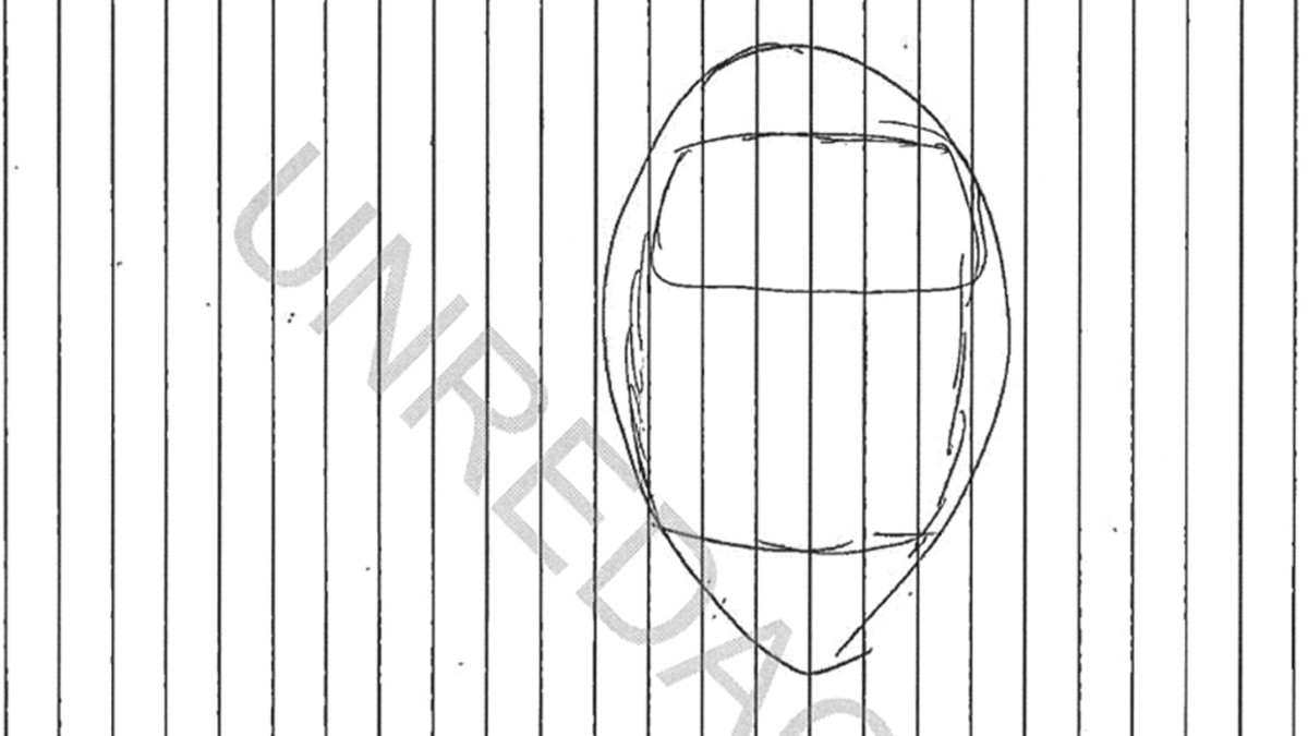 A copy of drawing of a blaclava-style mask on a sideways sheet of lined paper, with the word "unredacted" superimposed diagonally