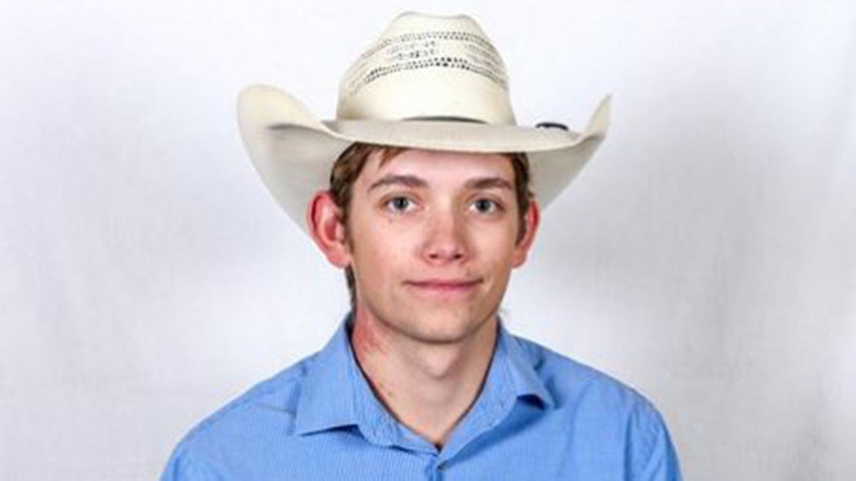 Photo of Grant in cowboy hat
