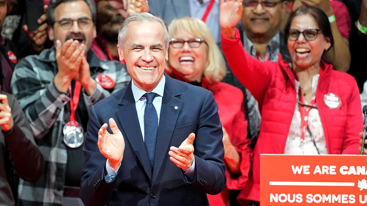 Canadian Prime Minister Mark Carney clapping
