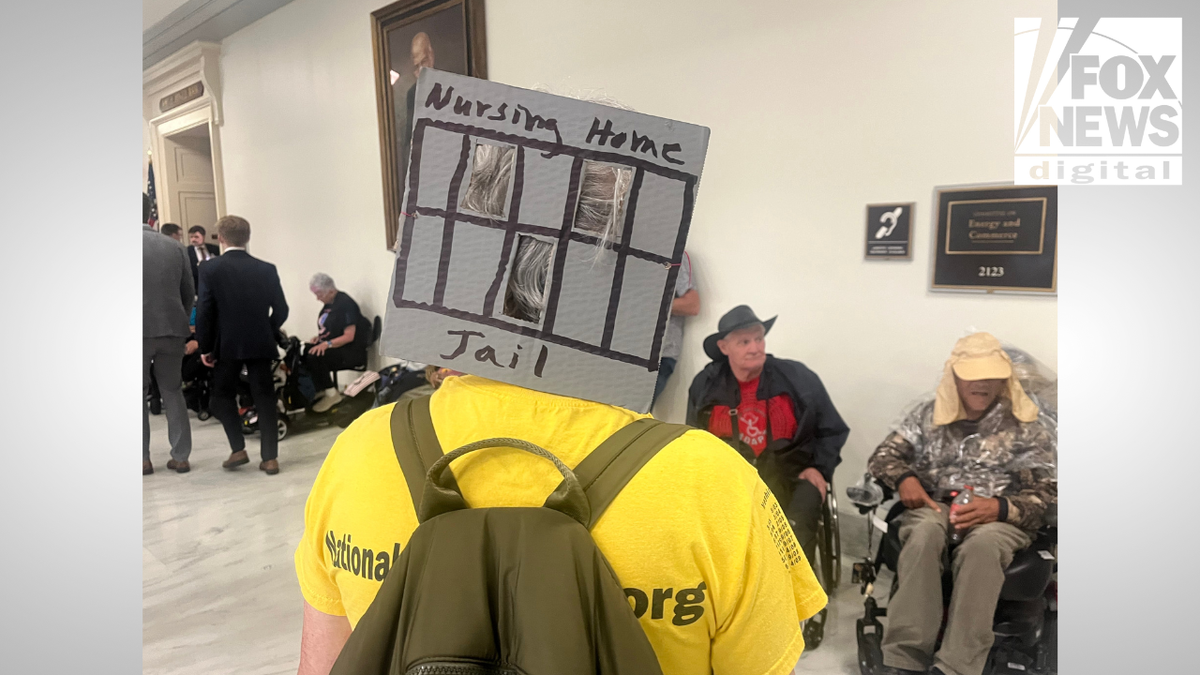 closeup of protester from behind at Capitol Hill protest on May 13, 2025