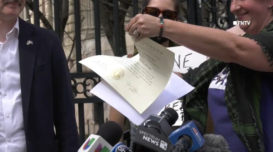 Columbia University grads shred diplomas in protest over school's cooperation with Trump administration