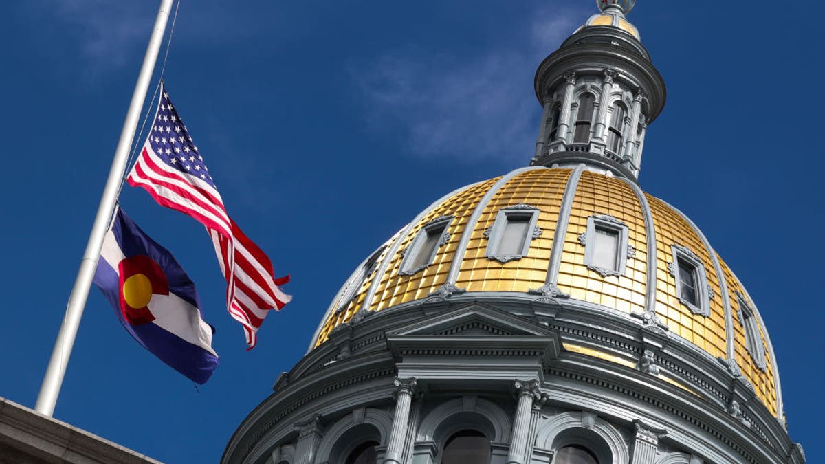 Colorado Capitol dome with flags at half staff