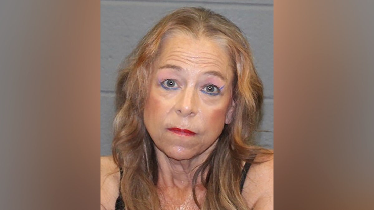 Kimberly Sullivan is seen in her mugshot after arrest for alleged abuse