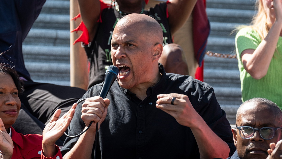Sen. Cory Booker, D-N.J., speaks during a livestreamed sit-in against the GOP funding plan on the steps of the House of Representatives on April 27, 2025, in Washington, D.C.