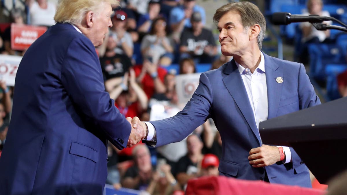 Donald Trump shakes hands with Dr. Mehmet Oz