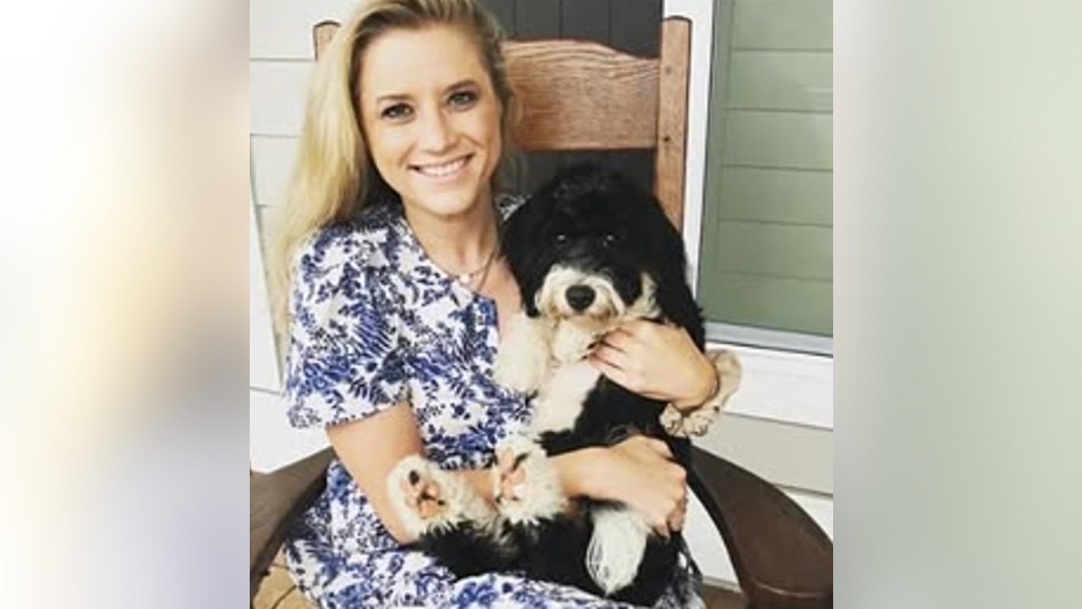 Whitney Hurd poses with her dog