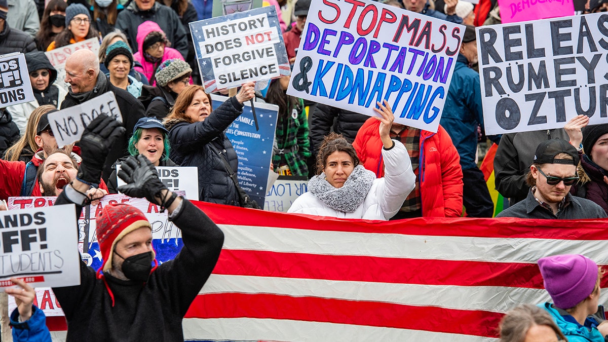 Demonstrators gather on Boston Common, cheering and chanting slogans, during the nationwide "Hands Off!" protest against US President Donald Trump and his advisor, Tesla CEO Elon Musk, in Boston, Massachusetts on April 5, 2025. (Photo by Joseph Prezioso / AFP) (Photo by JOSEPH PREZIOSO/AFP via Getty Images)