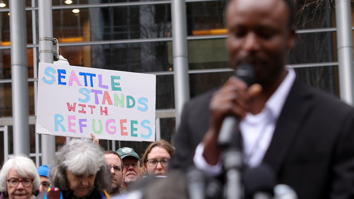 signs in support of refugees coming to U.S.