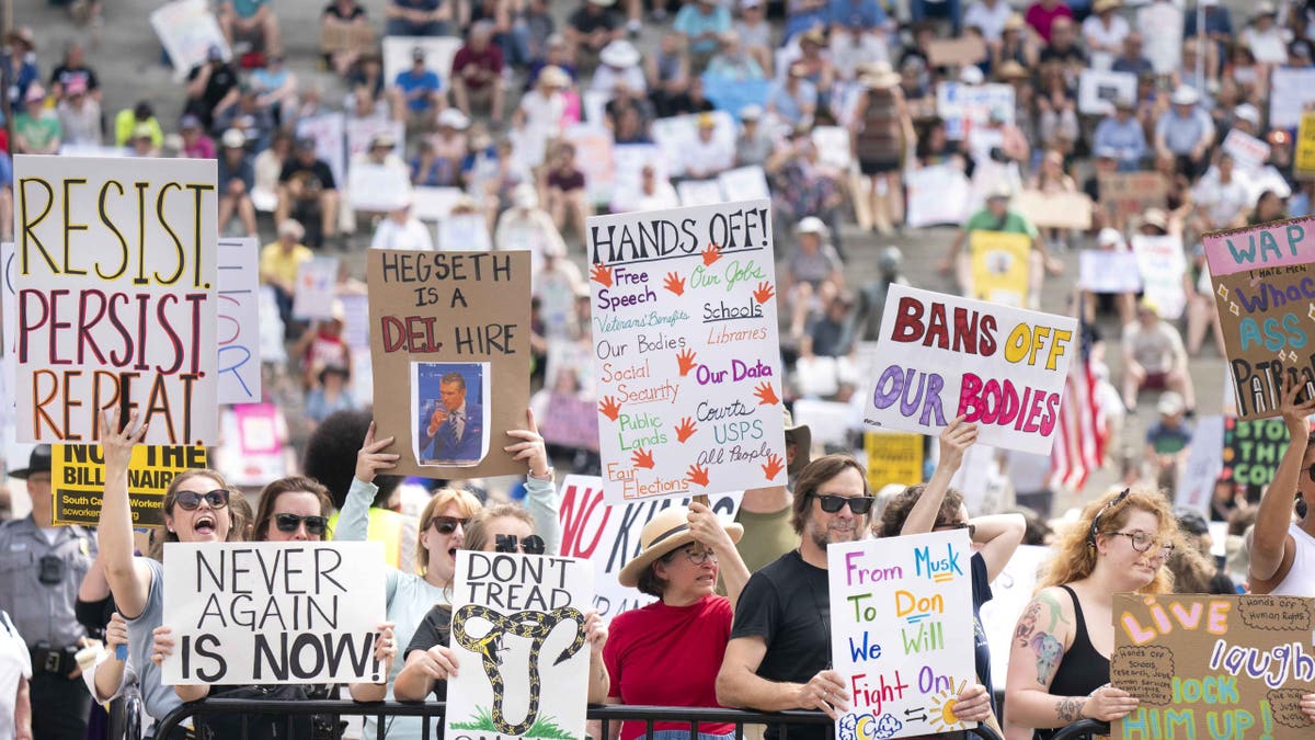 COLUMBIA, SOUTH CAROLINA - APRIL 5: Demonstrators participate in a Hands Off protest at the statehouse on April 5, 2025 in Columbia, South Carolina. Protests against Trump administration policies and Elon Musk's Department of Government Efficiency (DOGE) are being held nationwide in what organizers are calling a National Day of Action. (Photo by Sean Rayford/Getty Images)